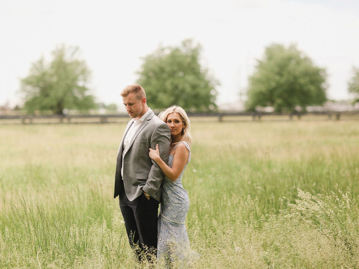 Couple standing in field